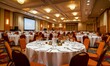 © jambulart - Elegantly decorated banquet hall, many tables set for a formal