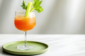 Wall Mural - Refreshing drink with vibrant orange hue garnished with celery s