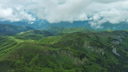 Wall Mural - aerial view of clouds over summer green mountains landscape, montenegro, 4k