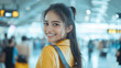 © Ari - Malay woman in leather jacket smiling about to travel by airplane at airport