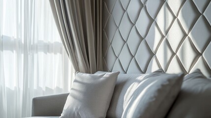 Poster - Elegant gray sofa with textured background in a luxurious bedroom highlighting modern design and natural daylight. Classic interior style.
