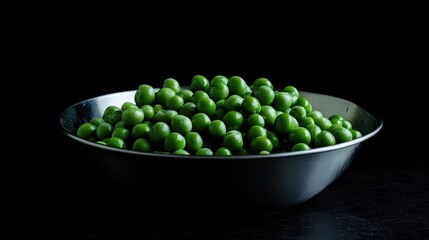 Poster - Freshly shelled green peas in a steel bowl showcasing vibrant color and nutrition on a dark background for food and health themes.