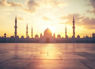 Wall Mural - A blurred background of an empty square in front of the silhouette of mosque buildings during sunset, with space for product display or presentation design elements. The sky is filled with soft clouds