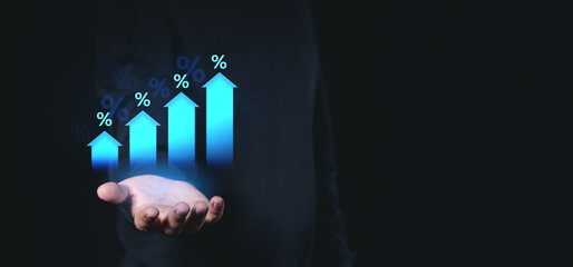 Poster - Hand holding glowing arrows with percentage symbols on dark background, symbolizing growth, success, and financial progress.