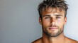 handsome man with strong jawline and tousled hair, exuding confidence