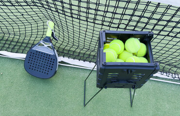 Wall Mural - Paddle tennis racket and ball image at outdoors court