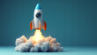 © robert - Toy rocket launching with fire and smoke billowing from behind against a plain blue background with copy space for text