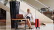 © wedmoments.stock - A business woman arrived at a modern hotel for a vacation or a business conference. A blonde businesswoman checks into her hotel room during her trip.