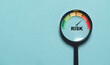 © Dilok - Risk level indicator rating since low to high inside of magnifier glass for Risk management and assessment con