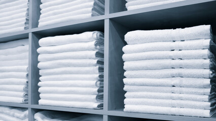 Leinwandbilder - White Towels Folded and Stacked on a Shelf