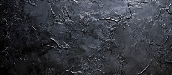 Poster - Dark gray and black textured background with intricate details and rough surface ideal for overlaying text or design elements