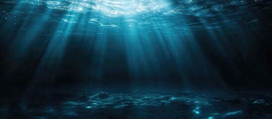 Poster - Dark underwater scene with light rays illuminating depths and ample copyspace for text or design elements