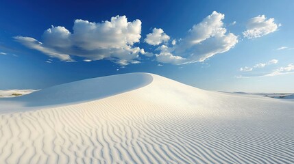 Leinwandbilder - Breathtaking view of pristine white sand dunes under a vibrant blue sky with fluffy clouds in a serene desert landscape.
