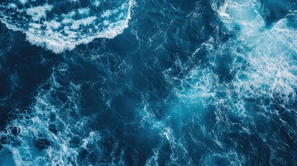 Leinwandbilder - Aerial view of turbulent blue ocean waves creating dynamic texture with ample copyspace for text placement and design elements.
