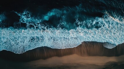 Leinwandbilder - Aerial view of vibrant ocean waves crashing on a dark sandy beach with ample space for text or graphics placement