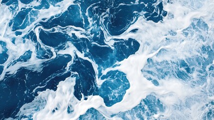 Poster - Aerial view of serene ocean waves creating captivating patterns of blue and white in natural waters