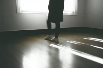 Poster - A soft-lit image capturing the shadows of a figure in a minimalist room, creating an atmosphere of contemplation, solitude, and introspection, highlighting the play of light and shadows.