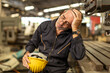 © Quality Stock Arts - Senior engineer worker tired exhausted sleep nap at work in heavy industry factory.