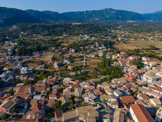 Wall Mural - Aerial drone  Cityscape  view of traditional mountain village Liapades at Corfu Island (Greece). 