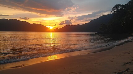 Poster - Vibrant sunset over tranquil beach and mountains.