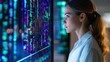 © tonstock - A woman analyzes data on a digital screen, showcasing the intersection of technology and scientific innovation.
