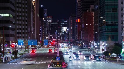 Canvas Print - aerial night timelapse street road view among city center of Nagoya in Chubu region business district area surrounding with modern building and crowded pedestrian people traffic along the street