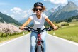 © EvgeniiasArt - Young caucasian female riding bicycle on scenic mountain road