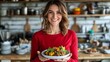 © Generative Media Lab - Woman presents healthy salad in kitchen.