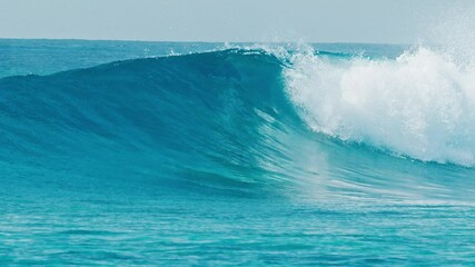 Wall Mural - Ocean wave rolls and breaks in the Maldives