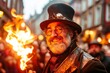 © Thanyarat - A street performer juggling fire in the Main Market Square, with an excited crowd clapping and cheering
