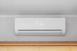 © markobe - White Air Conditioner Mini Split Unit Mounted at Wall in Room
