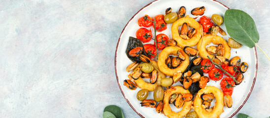 Canvas Print - Grilled mussels with herbs and squid rings.