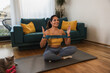 © milanmarkovic78 - Woman Exercising With Resistance Band