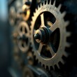 © Masum - A close-up image of a gear in focus, with other gears blurred in the background.