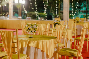 Wall Mural - Vibrant Indian Haldi ceremony decorations featuring marigold garlands, colorful drapes, and traditional motifs, creating a festive and joyful atmosphere for the pre-wedding ritual