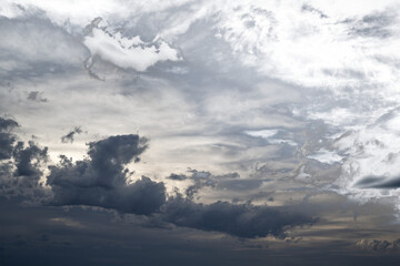 Wall Mural - sky only with dark to light clouds and patchy transparency
