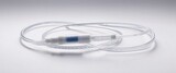 A clear and sterile IV tube neatly coiled on a pristine white background, showcasing its medical-grade design