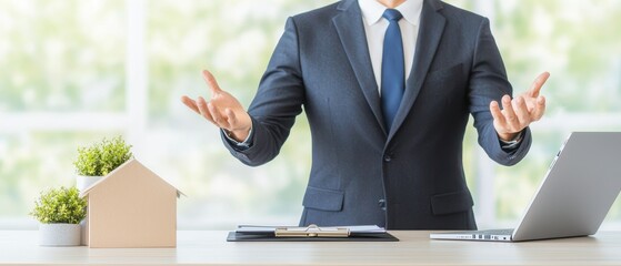 Poster - Business Person in Suit with Laptop and House Model Engaging in Discussion at Modern Office Environment