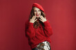© Alliance - smiling elegant woman in red sweater and beret