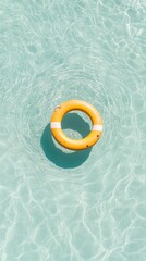 Poster - Bright yellow lifebuoy floating on the tranquil surface of a swimming pool. Creating a vibrant contrast against the clear turquoise water. Perfect for summer holidays. Travel. And resort advertising