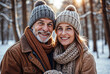 © Віталій Рудь - A man and a woman pose happily in the snow, embracing winter