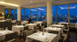 © StockWorld - Upscale Restaurant with Stunning City Skyline Night View