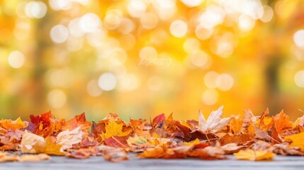 Wall Mural - Colorful autumn leaves create a beautiful display on a rustic wooden surface, with a soft focus background of warm foliage hues