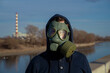 © phoenix021 - Portrait of a man with green gas mask outdoors