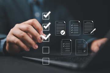 Fototapete - Digital form checklist, Online survey concept. Man interacts with digital form checklist on laptop with process of filling out online survey and completing digital forms with checkbox and document.
