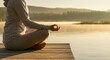 © Tati - Person meditating on dock by lake at sunrise, promoting calmness and mindfulness