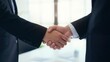 © AnCreaSpace - Business Agreement Sealed with a Firm Handshake in Professional Meeting