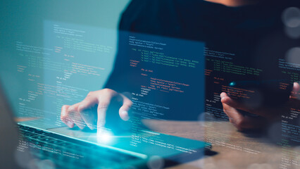 Computer programmer, software engineer typing, coding javascript on laptop computer, software development concept. Website design and coding technology