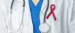 © Jo Panuwat D - Doctor with Burgundy Red Ribbon for March multiple myeloma Cancer and December World Aids Day Awareness month. Healthcare and world cancer day concept