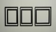 © Adobe worker  - Three identical black frames in a row on light gray wall, ready for image insertion. minimalist,grey, image, minimalist, row, three, frame, 456